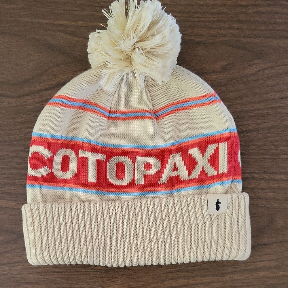 Cotopaxi Cream and Red Pom-Pom Beanie